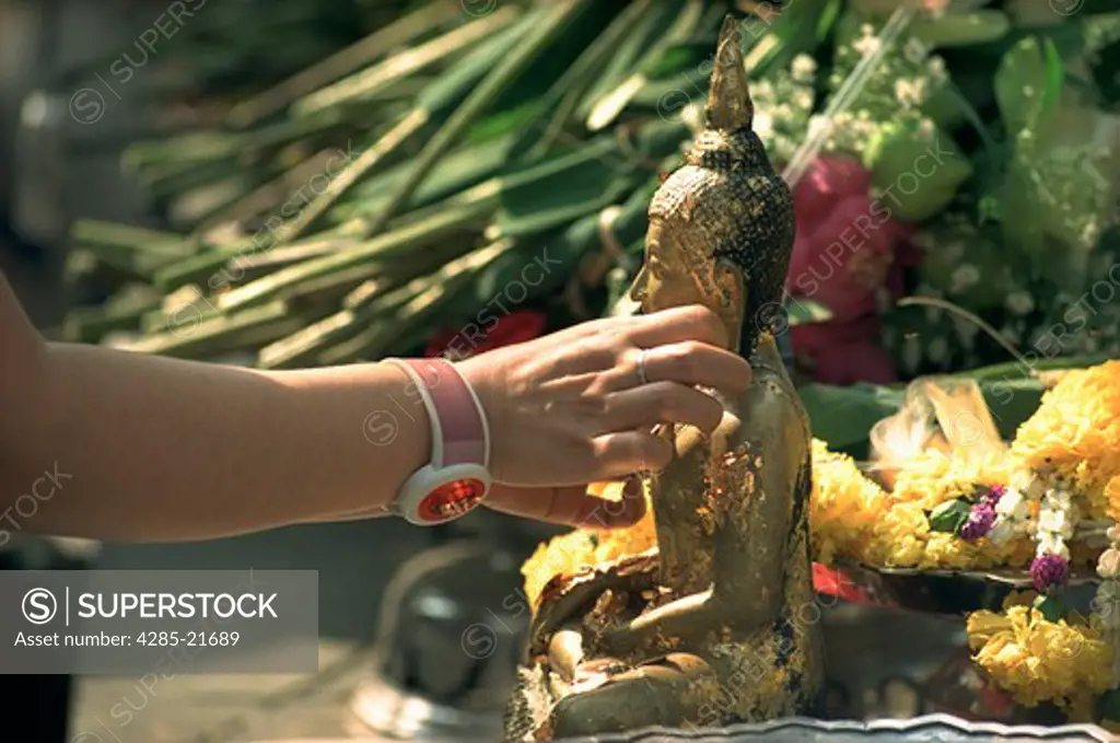 Thailand, Bangkok, Wat Pra Kaeo, Placing Gold Leaf on Buddha