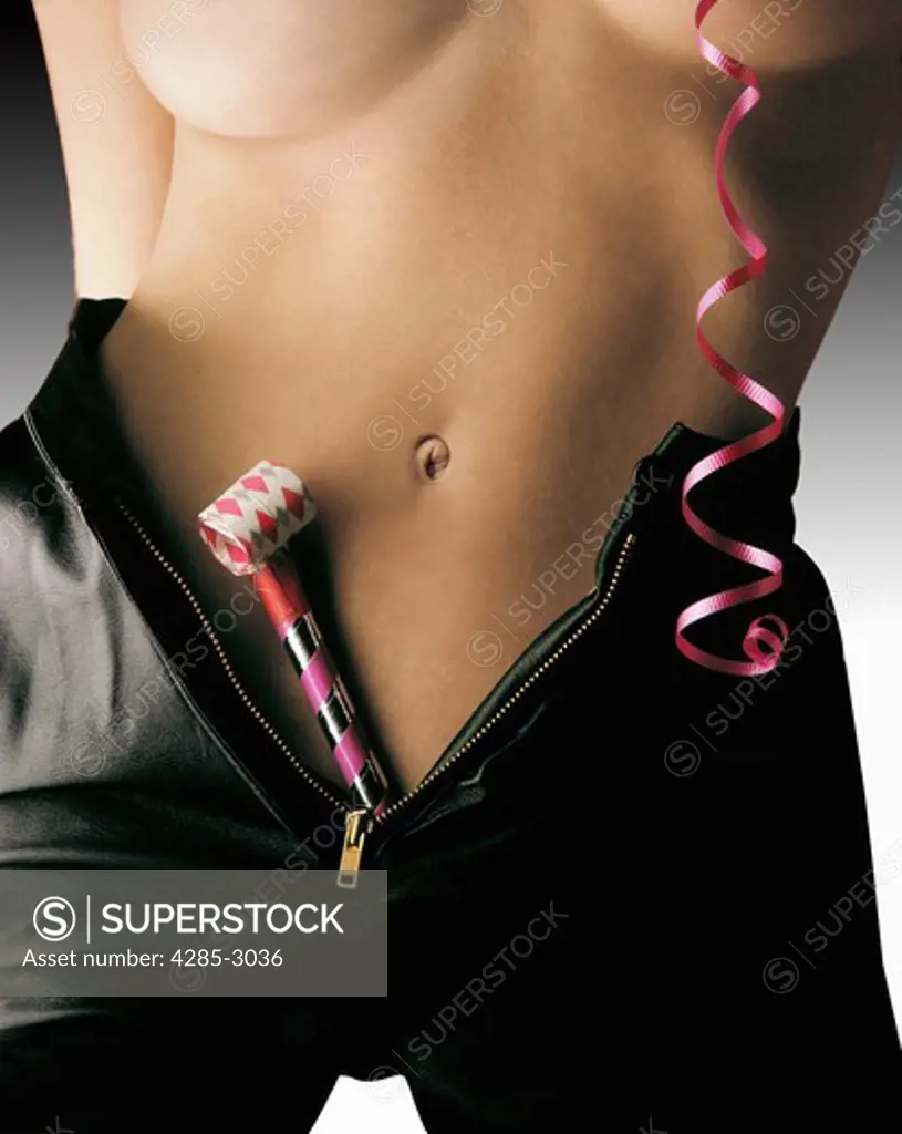 Girl naked torso and belly button, tanned, with black leather shorts, zippered down, with party streamer and party whistle.