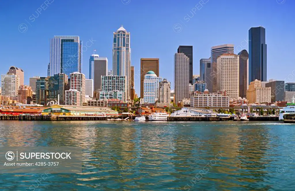 view of Seattle, WA from the water on a sunny day with blue sky