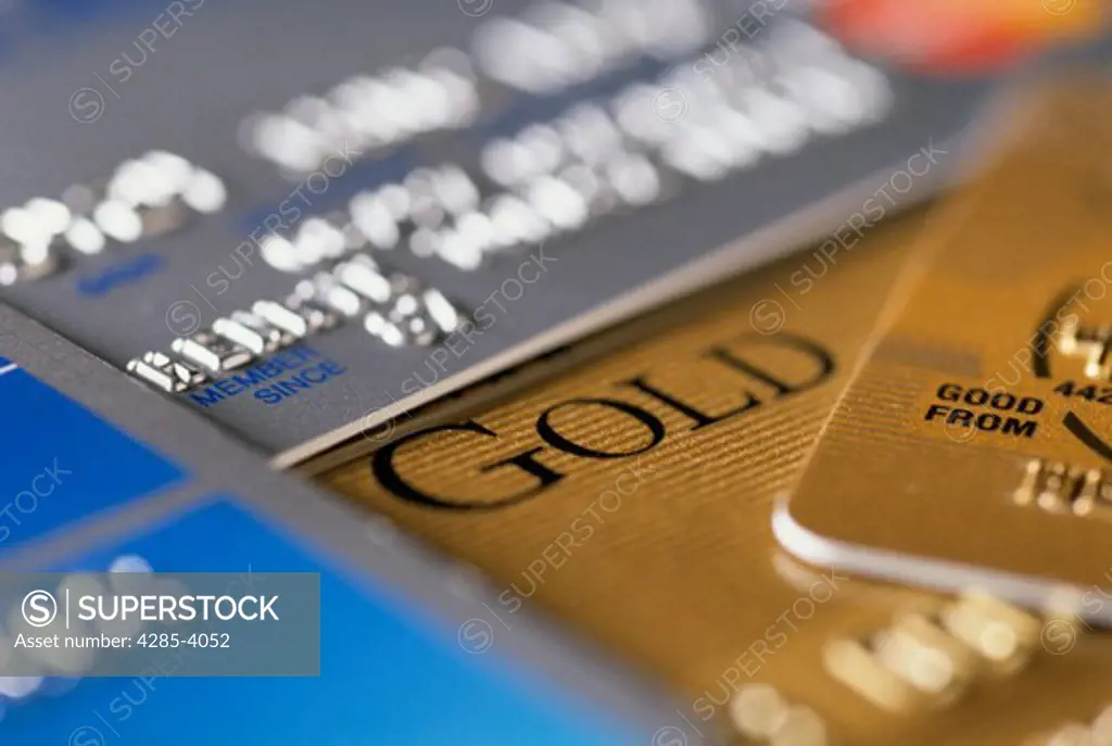 Close-up of various gold and platinum credit cards.