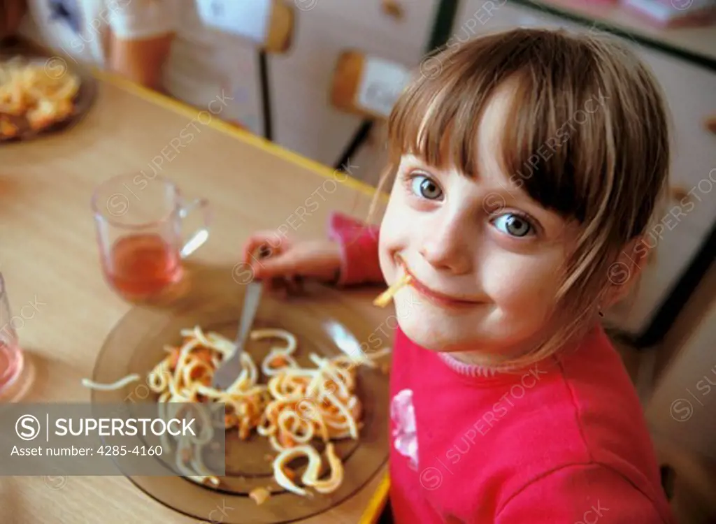 Girl eating spaghettii smile, kindergarten,  MR9034