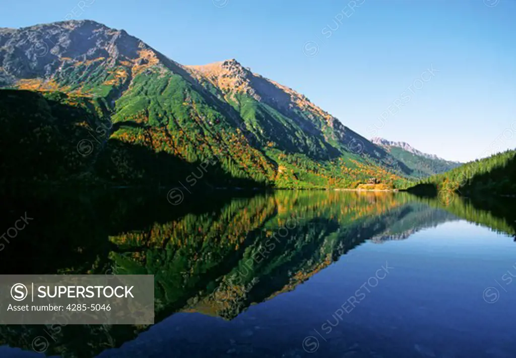 Morning light on Eye of the Sea lake in Tatras Mt Poland