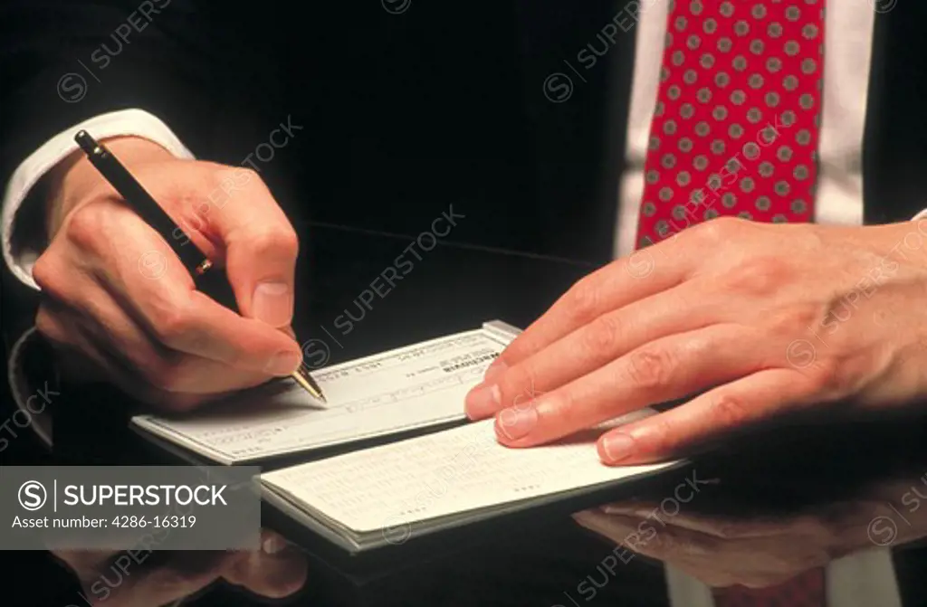 Man writing check