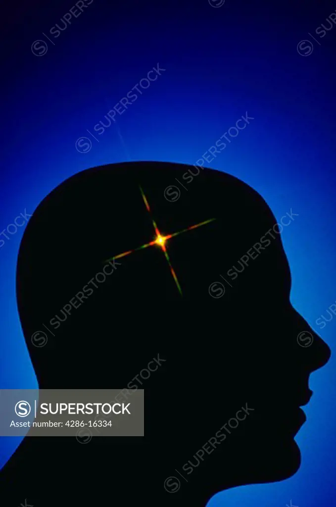 Silhouette of head with starburst