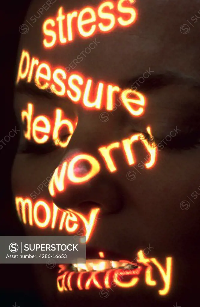 Close-up of a woman¡s face with the words stress, pressure, debt, worry, money and anxiety superimposed on her face.