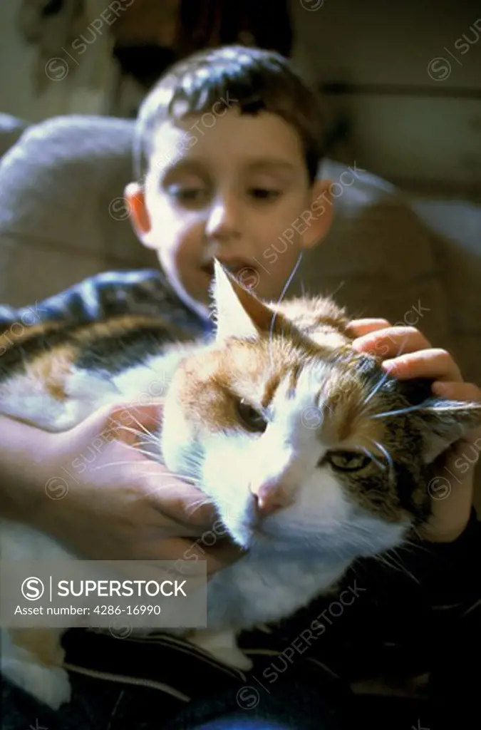 Boy with pet cat.