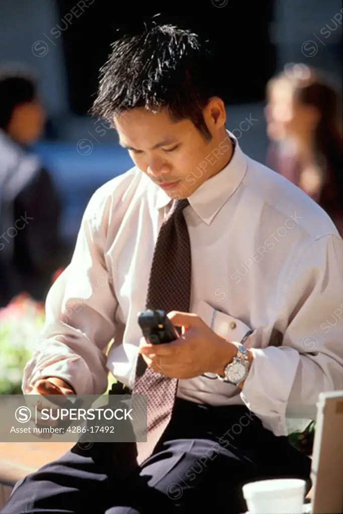 Asian man with pager & #56A
