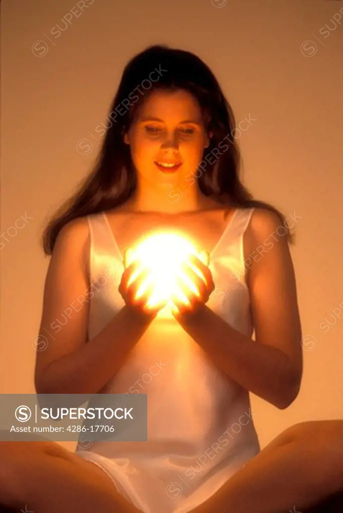 Woman gazes into crystal ball #97D
