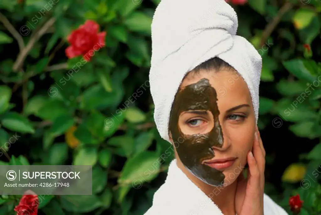 Woman at spa with mud masque.