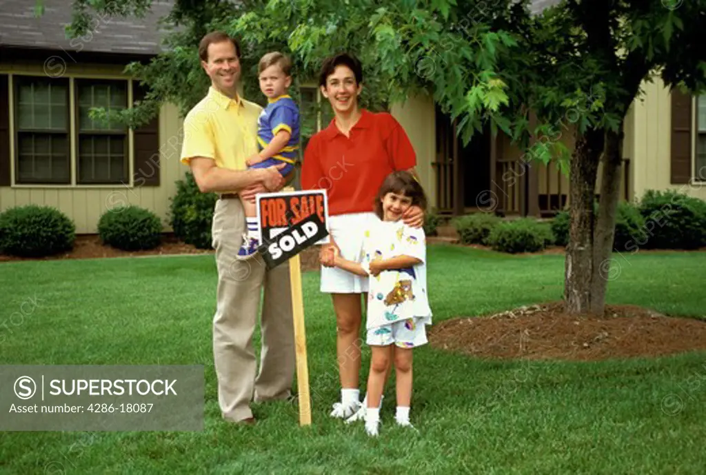 Family in newly purchased (or sold)  home.