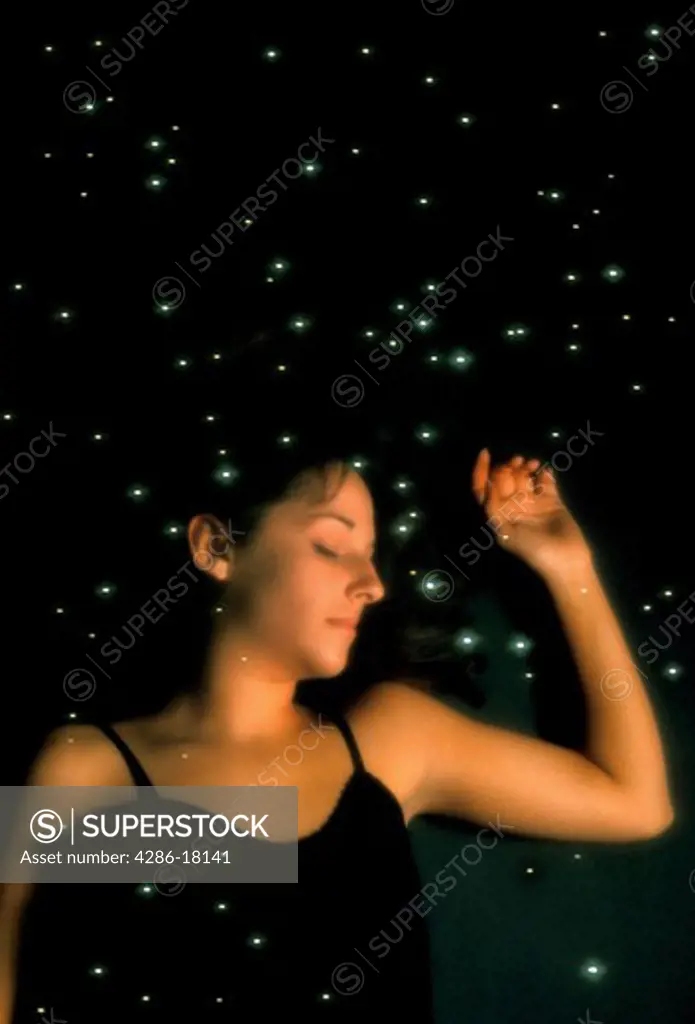 Woman dreaming. Sleeping woman and stars.