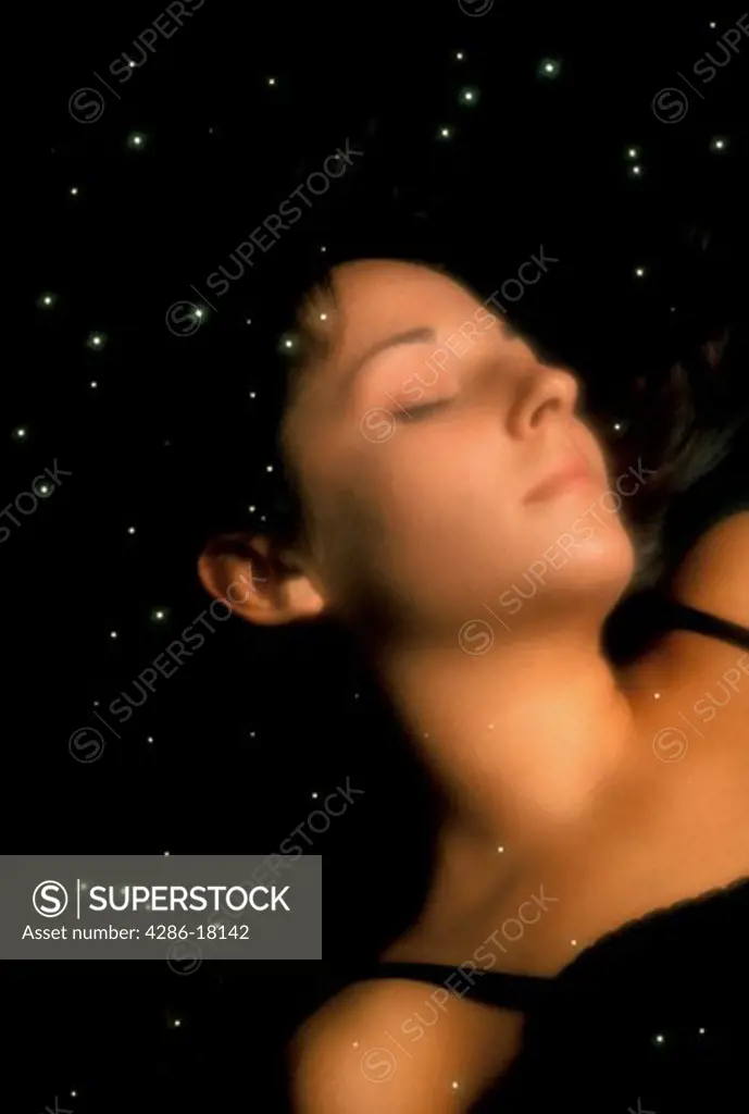 Woman dreaming. Sleeping woman and stars.
