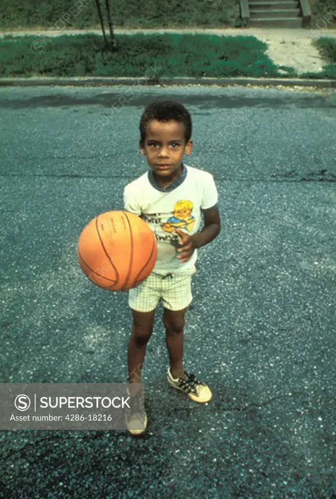 Young boy with basketball.