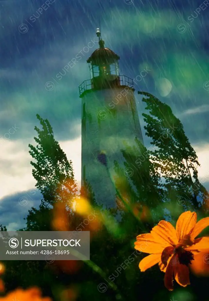 Lighthouse in summer shower