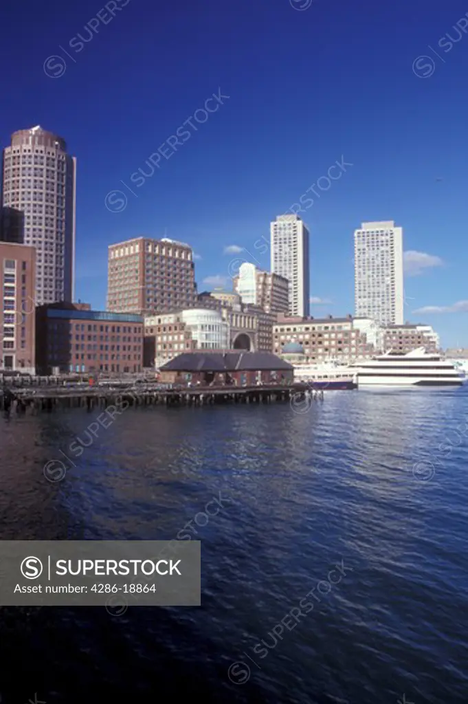Boston, Massachusetts, The skyline of downtown Boston rises above the water of the Boston Harbor.