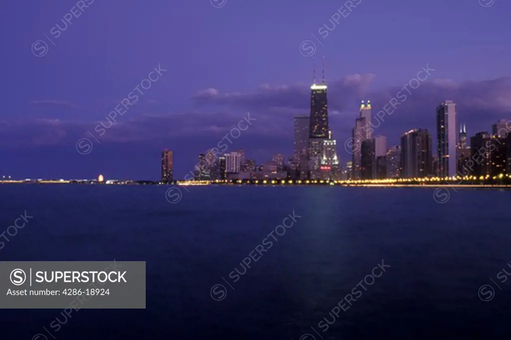 Chicago, Illinois, The illuminated skyline of downtown Chicago from the waters of Lake Michigan at night.