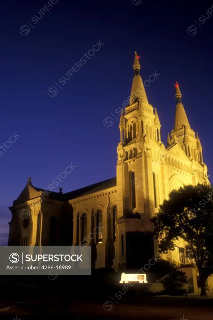 South Dakota, Saint Joseph's Cathedral is illuminated at night in Sioux Falls. French and German Romanesque Architecture.