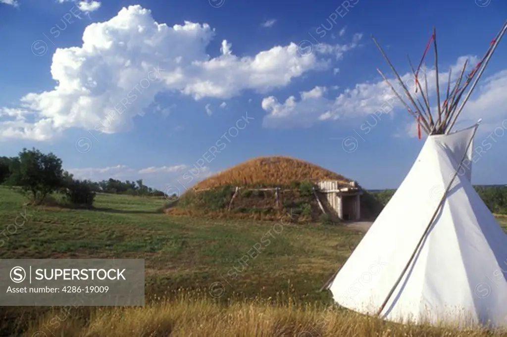 North Dakota, Teepee and earth lodge are exhibited at On-a-Slant Mandan Indian Village at Fort Abraham Lincoln State Park in Mandan. 