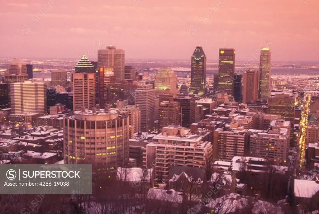 Canada, Quebec, Montreal, Aerial view of the downtown skyline of Montreal from Mont Royal in the evening.
