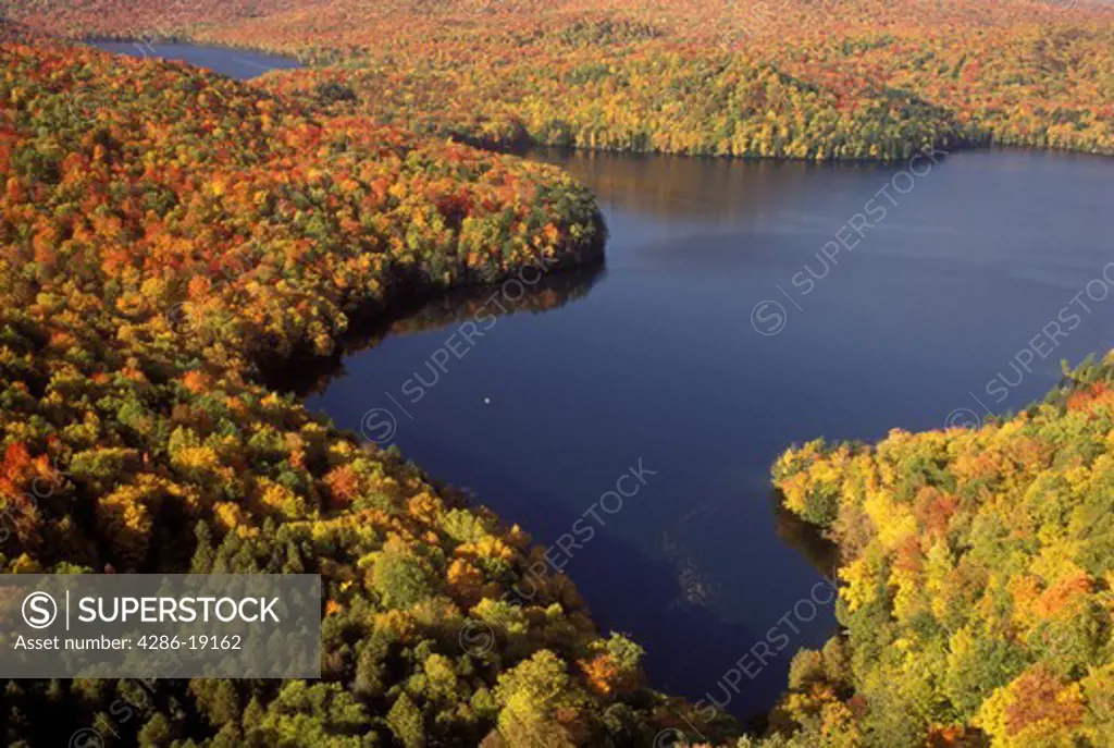 Vermont, A spectacular view of Nichols Pond in the fall from Nichols Ledge in Woodbury.