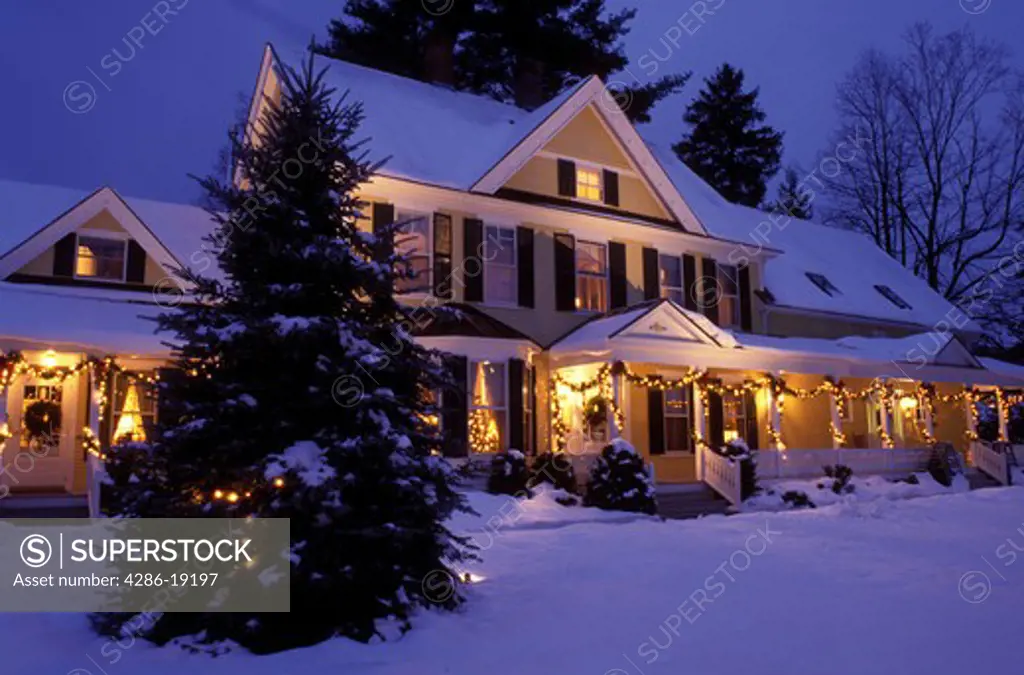 Vermont, Woodstock, B&B, inn, Christmas, The Jackson House Inn is illuminated with Christmas decorations on a snow covered night, evening in West Woodstock.