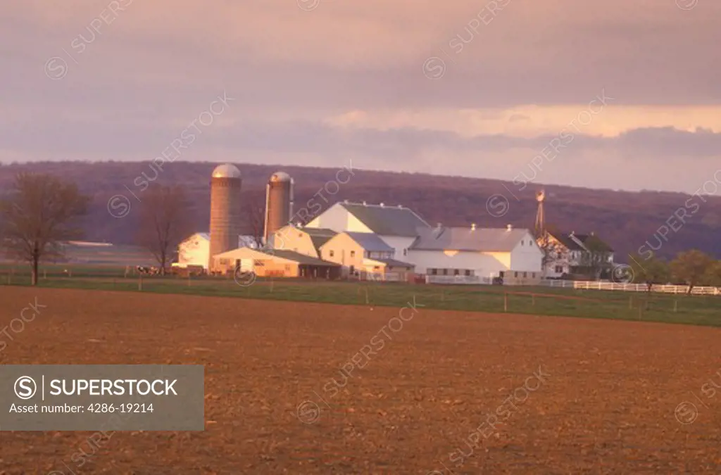 Amish, Pennsylvania, Lancaster County, Freshly plowed fields in early evenig light on scenic Amish farmland in picturesque Pennsylvania Dutch Country.