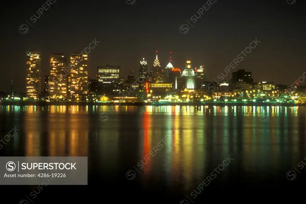 Philadelphia, skyline, Pennsylvania, The illuminated skyline of downtown Philadelphia reflects in the calm waters of the Delaware River in the evening, Pennsylvania.