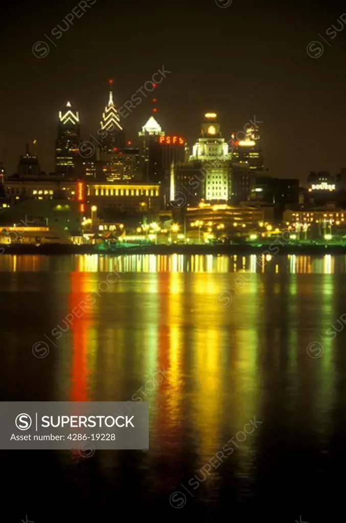 skyline, Philadelphia, Pennsylvania, The illuminated skyline of downtown Philadelphia reflects in the calm waters of the Delaware River in the evening, Pennsylvania.