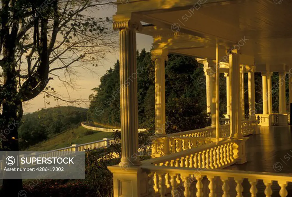 mansion, Blue Ridge Parkway, Moses H. Cone Memorial Park, North Carolina, Golden sunlight shines on the white columns of the porch of the mansion at Moses H. Cone Memorial Park.