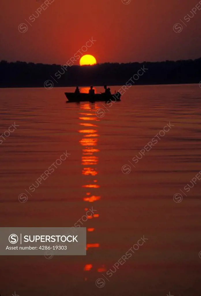 boat, sunset, fishing, Kentucky Lake, Kentucky, Men fishing in a boat as the sunsets, sunrises over Land Between the Lakes National Recreation Area.