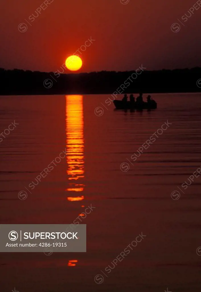 sunrise, sunset, boat, lake, Kentucky, Kentucky Lake, Fishermen in a boat that is silhouetted by the sun rising over the Land Between the Lakes National Recreation Area.