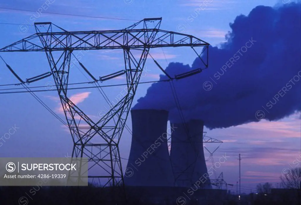 nuclear power plant, powers lines, Pennsylvania, steam rises from the cooling towers of the Philadelphia Electric Co. nuclear power plant next to power lines in Limerick in the evening.