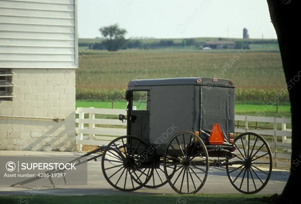 amish, buggy, amish country, Lancaster County, Pennsylvania, Pennsylvania Dutch Country, An Amish covered buggy is parked outside an Amish farm in Lancaster in the state of Pennsylvania. 