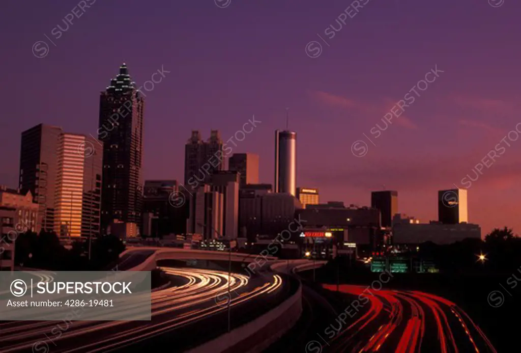 Atlanta, downtown skyline, Georgia, Skyline of downtown Atlanta and streaks of car lights on Downtown Connector Interstate I-85/I-75 from North Avenue at sunset in the state of Georgia. 