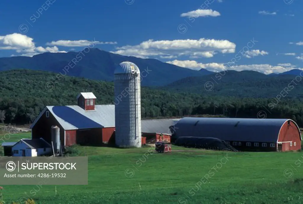 Vermont, VT, Red barn at Tinker Farm and view of Mt. Mansfield in Fletcher.