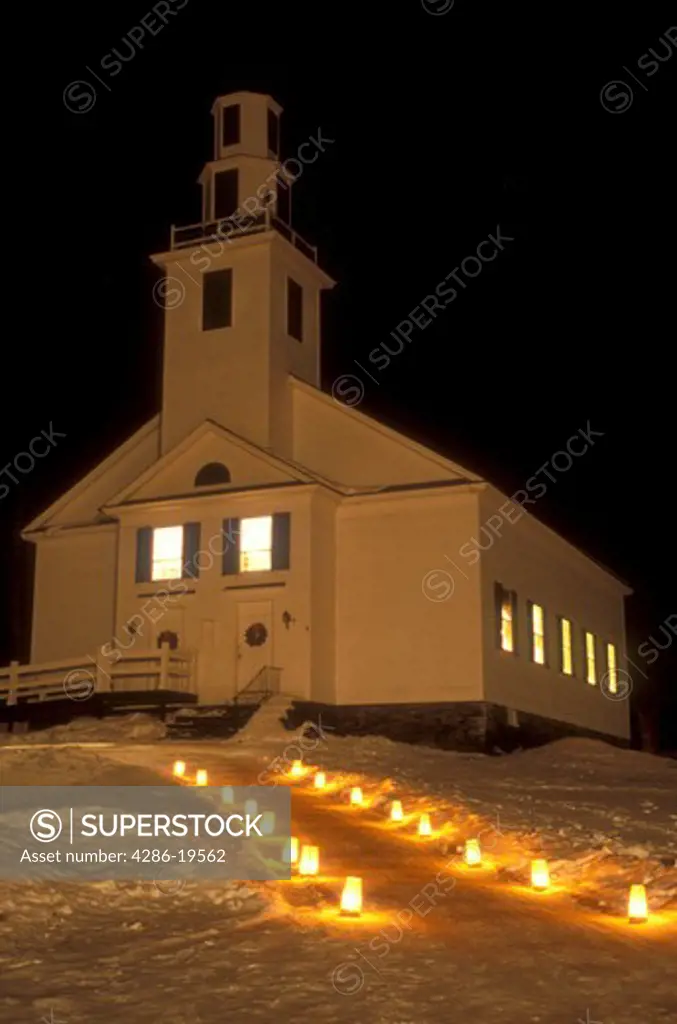 church, chapel, candles, decorations, outdoor, holiday, Christmas, snow, winter, The path to the Old Meeting House is lit with candles for Christmas Eve service in East Montpelier Center on a snow covered night in Washington County in the state of Vermont. 