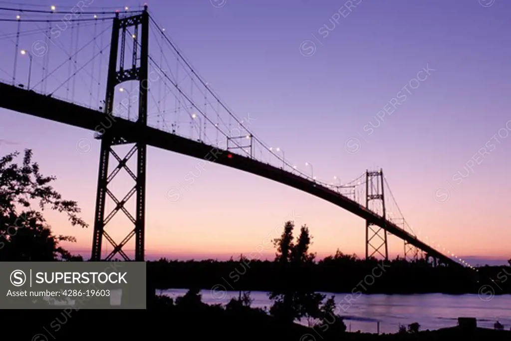 bridge, International Bridge, Thousand Islands, Alexandria Bay, New York, St. Lawrence River, NY, International Bridge at sunset crosses the St. Lawrence River into Ontario, Canada.