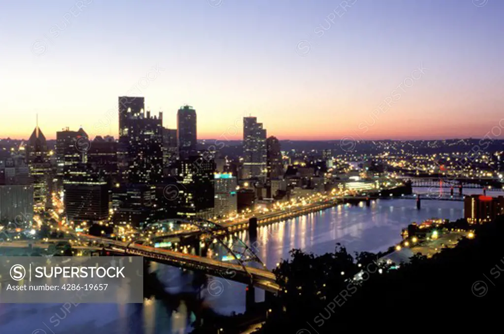 skyline, Pittsburgh, PA, Pennsylvania, aerial view of the downtown skyline of Pittsburgh illuminated at sunrise along the Monongahela River.