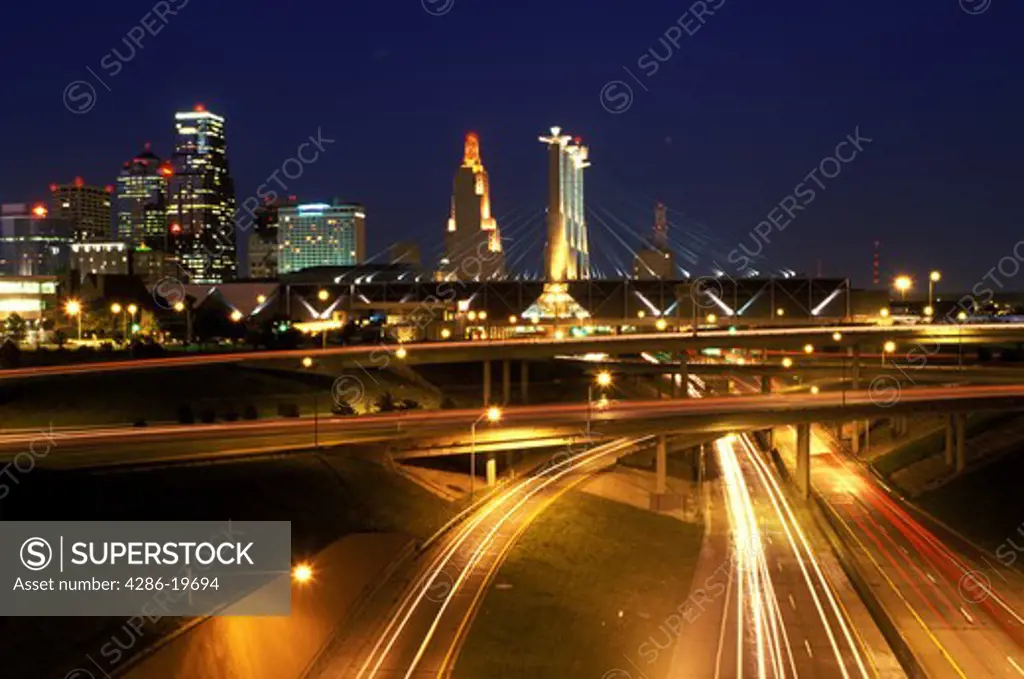 skyline, expressway, Kansas City, MO, Missouri, downtown skyline of Kansas City and I-670/I-35 at night.
