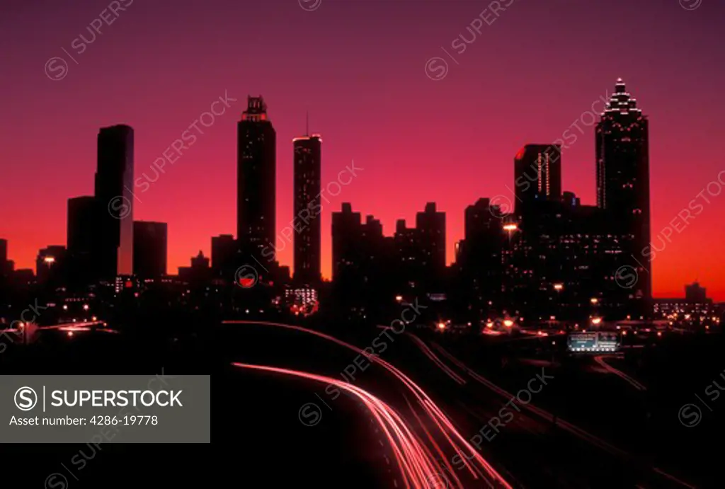 skyline, Atlanta, Georgia, GA, Skyline of downtown Atlanta and traffic from Jackson Street at sunset. 