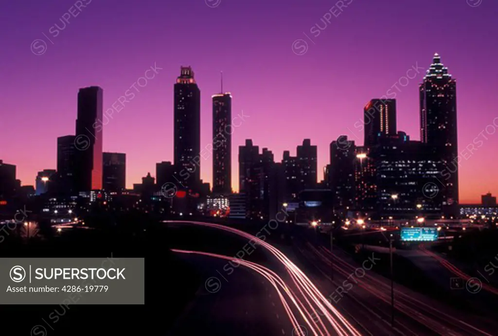 downtown skyline, Atlanta, Georgia, GA, Skyline of downtown Atlanta and traffic from Jackson Street at sunset. 