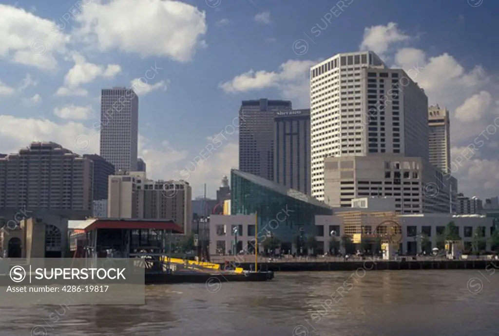 New Orleans, Louisiana, LA, View of the Aquarium of the Americas and downtown New Orleans along the Mississippi River.