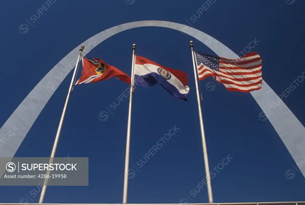 Gateway Arch, arch, St. Louis, MO, Missouri, American flags fly outside the Gateway Arch, Jefferson National Expansion Memorial, in Saint Louis.