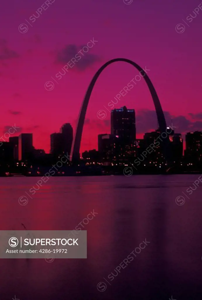 St. Louis, Gateway Arch, MO, Missouri, View of the Gateway Arch and downtown skyline of Saint Louis along the Mississippi River at sunset. 