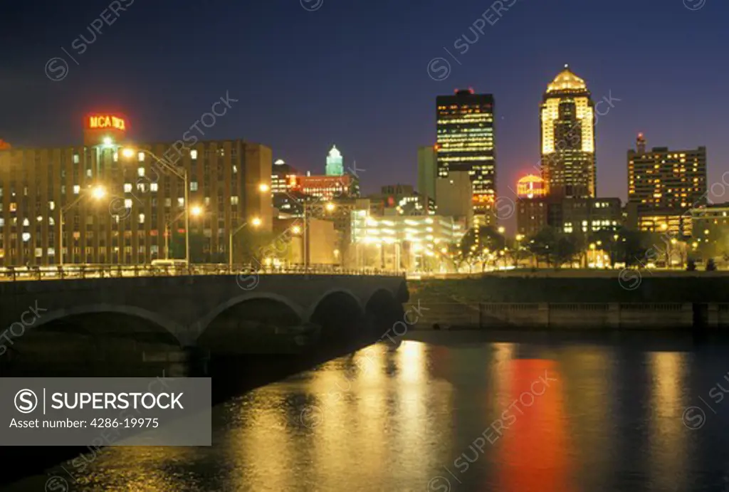 Des Moines, IA, Iowa, The downtown skyline of Des Moines reflects in the Des Moines River in the evening.