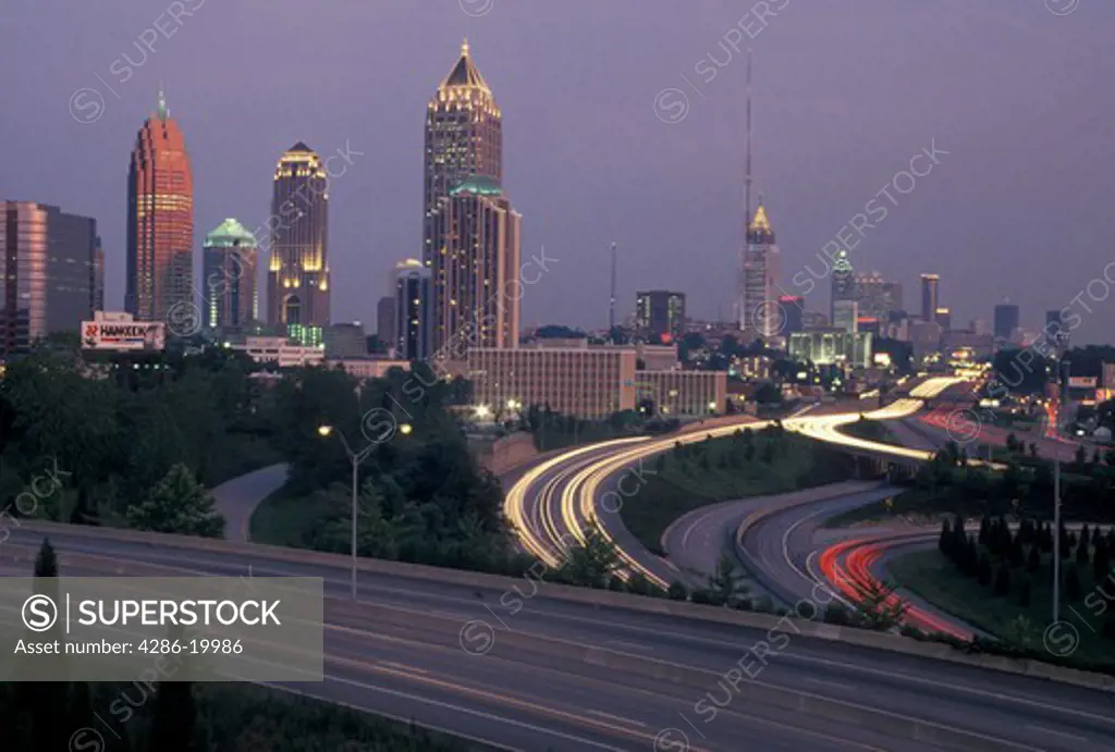 expressway, Atlanta, GA, Georgia, Downtown skyline of Atlanta and I-85 and I-75 at sunset.