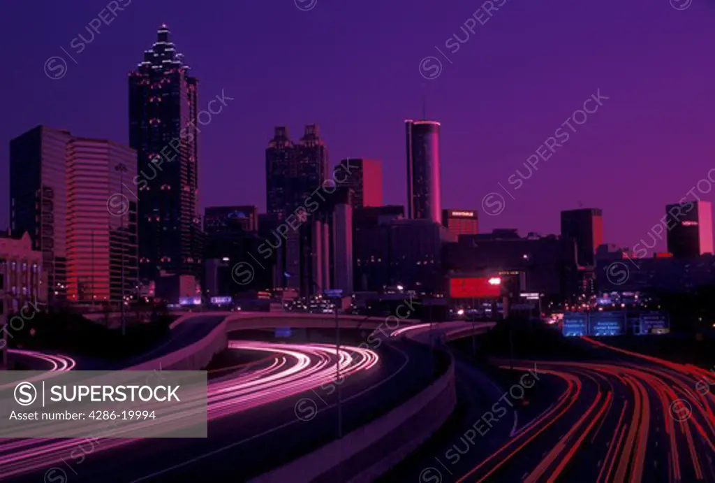 skyline, Atlanta, GA, downtown, Georgia, The downtown skyline of Atlanta at sunset with a stream of car lights on I-75 and I-85.