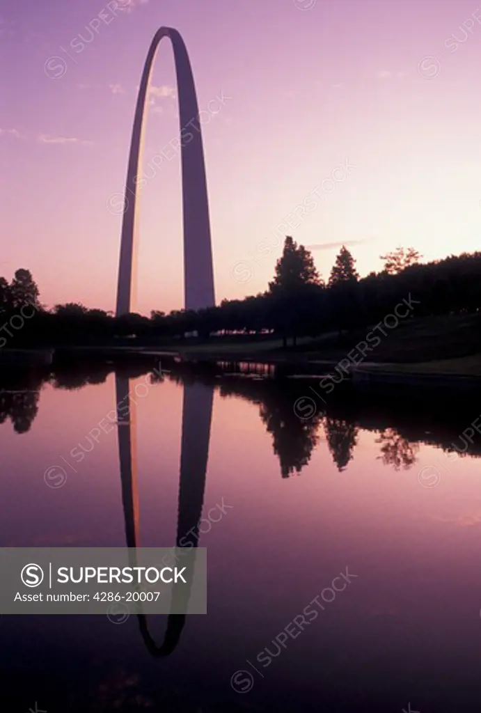 Gateway Arch, St. Louis, MO, Missouri, The Gateway Arch reflects in the pond at sunrise in Saint Louis. Jefferson National Expansion Memorial. Gateway to the West.