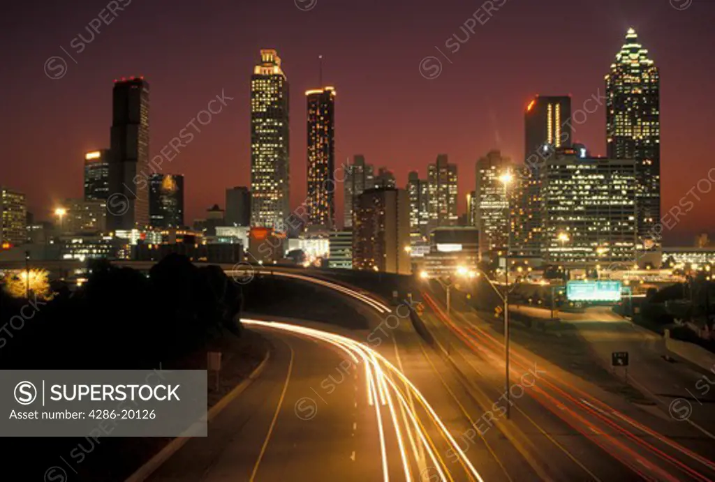 skyline, Atlanta, GA, Georgia, Downtown skyline of Atlanta and Freedom Parkway illuminated at night.