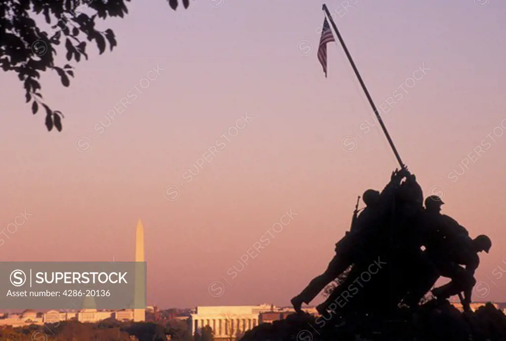 Iwo Jima, Washington, DC, Marine Corps Memorial, Arlington, VA, DC, Washington, Arlington National Cemetery, Virginia, sunset, A silhouette of the U.S. Marine Corps Memorial, Iwo Jima, at the Arlington Nat'l Cemetery overlooking Washington DC. Early morning light on Washington Monument, the Lincoln Memorial and US Capitol Building in the distance.